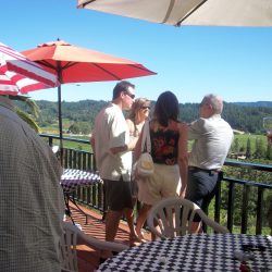 Summer party guests on balcony