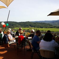 Summer party guests on balcony