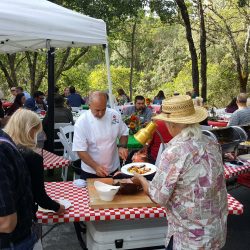 Summer party guests with food