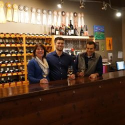 Travis and Norma at tasting room counter