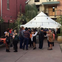 Summer party guests dancing